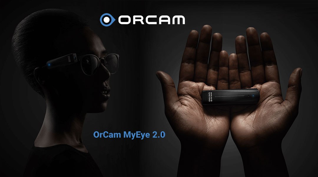 Hands holding the OrCam MyEye 2.0
