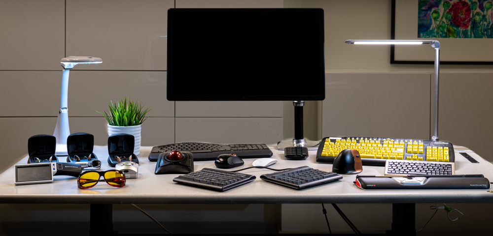 Desk with computer and assistive technology equipment