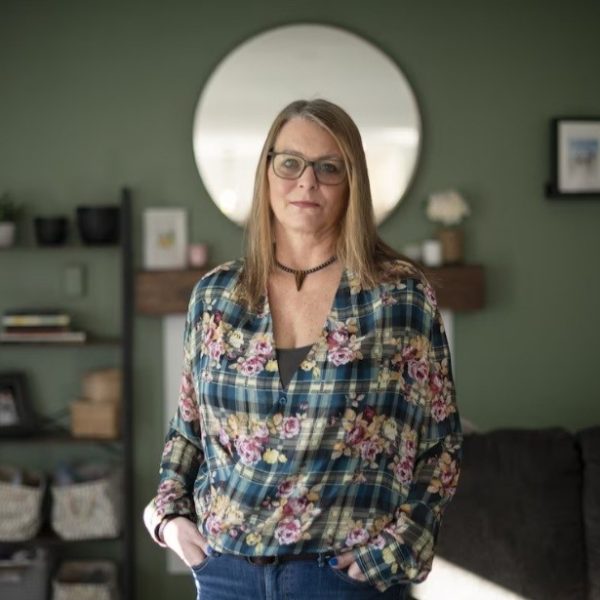 Kari standing in a living room.