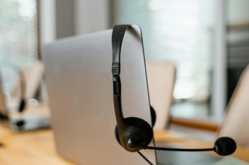 A headset resting on a laptop