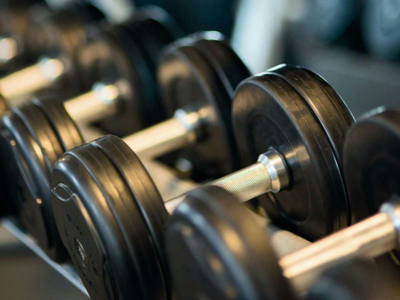 A row of dumbbells on the rack