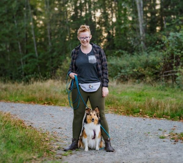 Kaeli walking a dog.